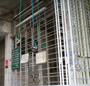 Scaramouchine was impressed by the ad hoc buzzer system invented by urban Yangonese.  Because few apartment buildings have working buzzers or elevators, the Burmese have invented a "string and clip" system whereby you can drop down a clip containing a key (as there is no way to buzz a person into the building) or some forgotten item, like an umbrella.